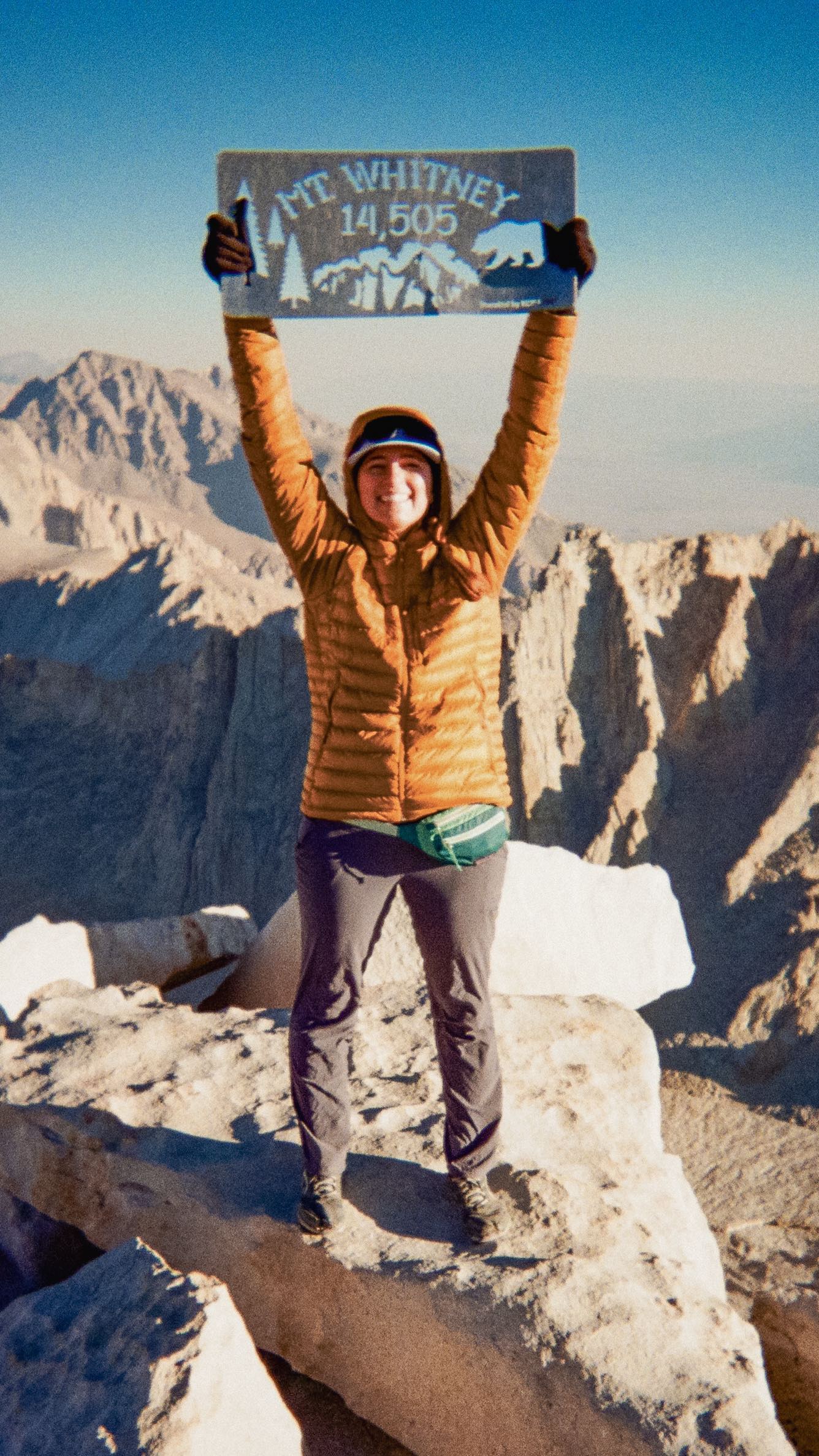 Almost all of 2024- we had one date circled. October 4th—our hike up Mt. Whitney. 🌄

At 14,505 feet, Mt. Whitney is the tallest peak in the contiguous US, a bucket list summit for many. But as the date got closer, so did my anxiety. Living at sea level, I don’t tackle high-altitude peaks often. My highest summit before this was just shy of 12,000 feet, and even that pushed me harder than expected. 

Our adventure started with a life-changing moment—Reid proposed that morning in Alabama Hills, with Mt. Whitney standing tall in the background. By 9am, we were at Whitney Portal weighing our packs. I packed ultralight, leaving my 10lbs of camera gear behind and opting for two disposable cameras. One went to Reid to capture candid moments along the trail, letting me focus on the present—with my new fiancée by my side. 

By the time we reached Trail Camp, we were both feeling the effects of the altitude with headaches and lightheadedness. But with clear skies and perfect conditions, we set our at 4:30am the next morning, making our way up the infamous 99 switchbacks under a sea of headlamps. 

At 8:00am, we reached the summit. No headaches, no dizziness—just pure euphoria. Standing at the top of Mt. Whitney felt surreal, especially after I spend so much time doubting myself. 

The biggest lesson? Never doubt what you’re capable of.